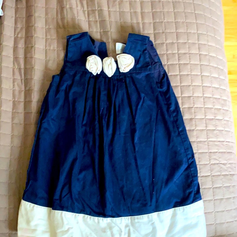 Navy tunic dress with floral embellishment